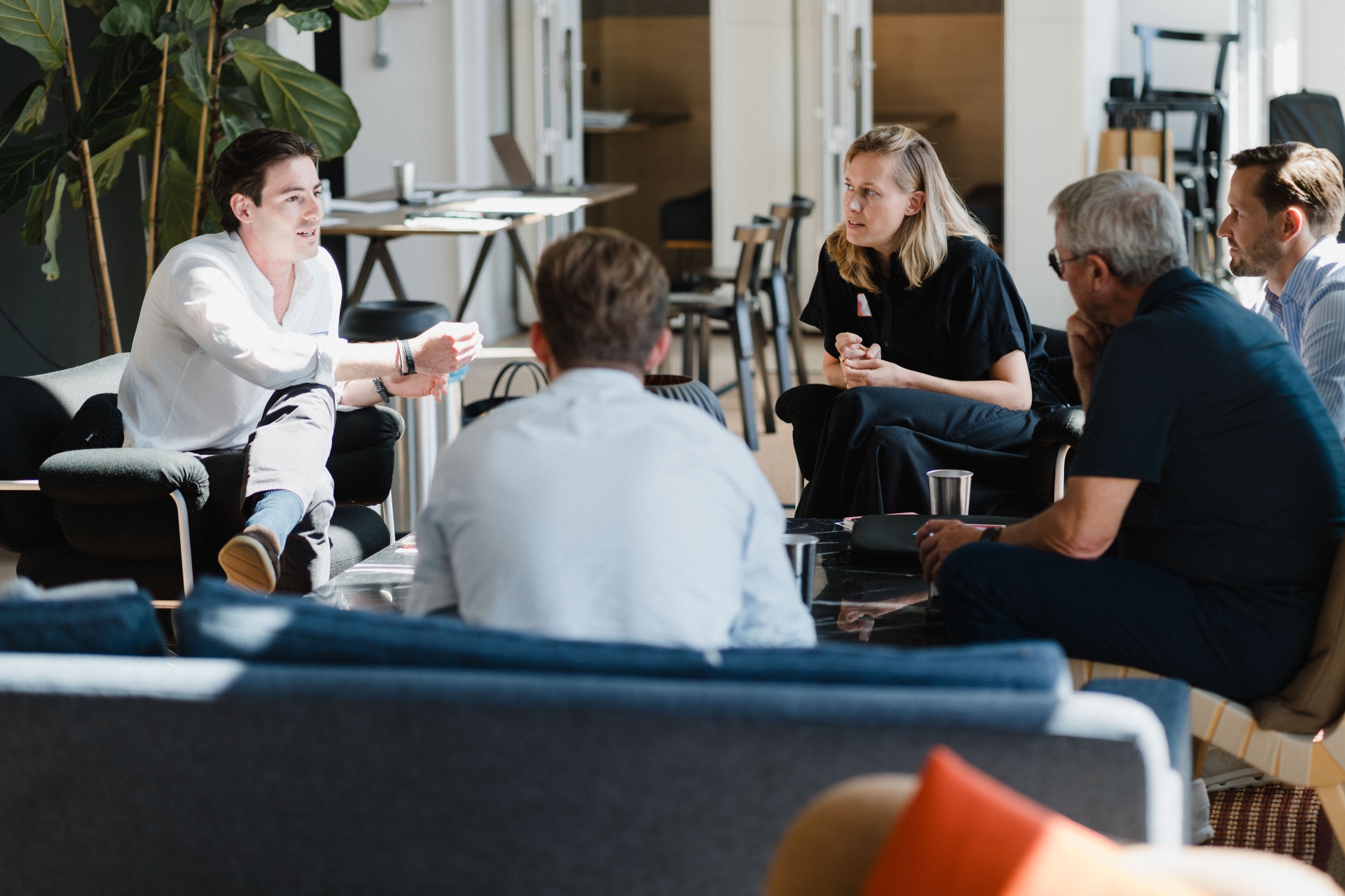 Small-group conversation in a lounge setting