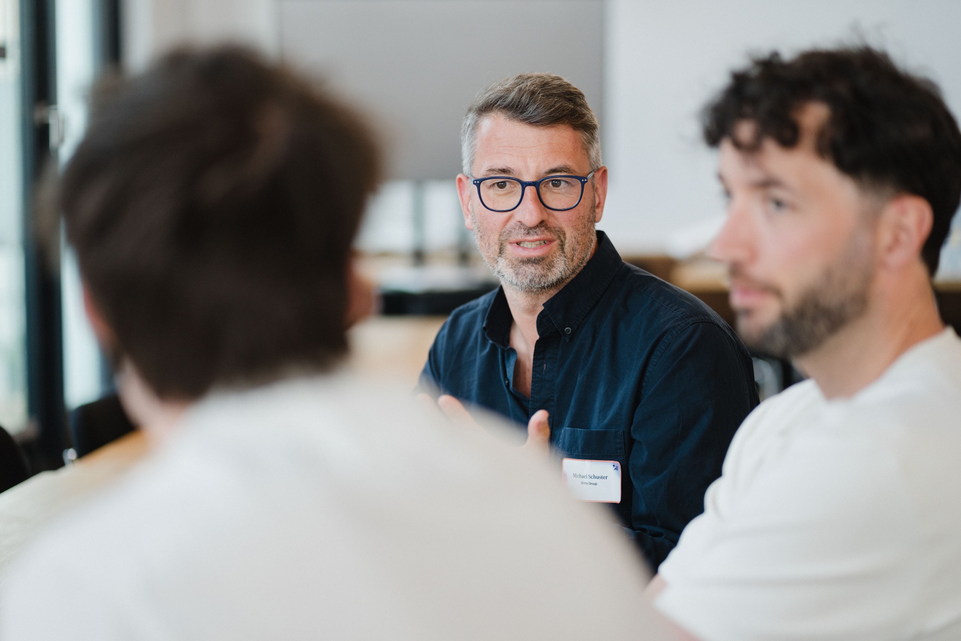 Executive sharing insights in a small group