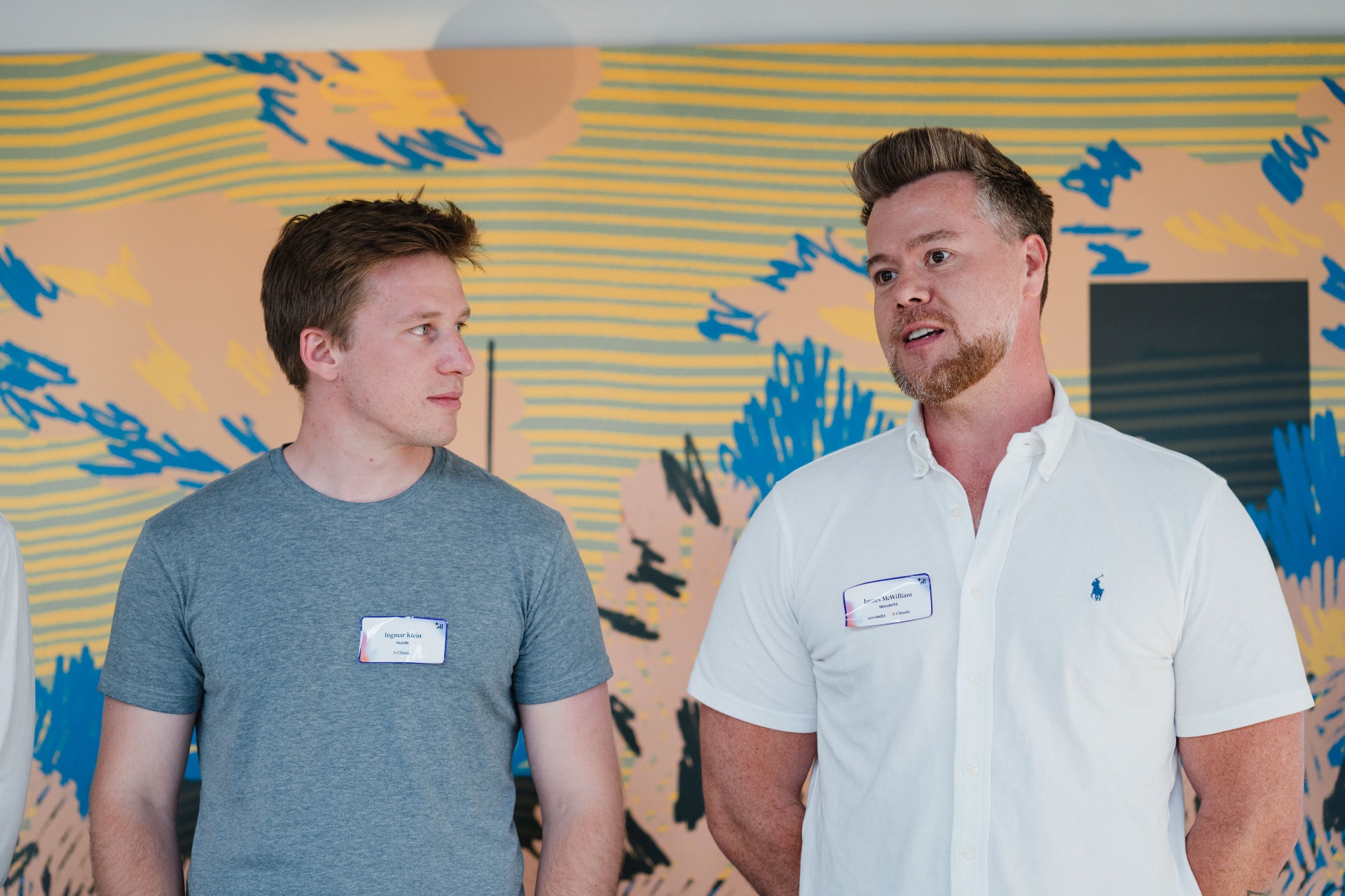 Two attendees talking at the forum